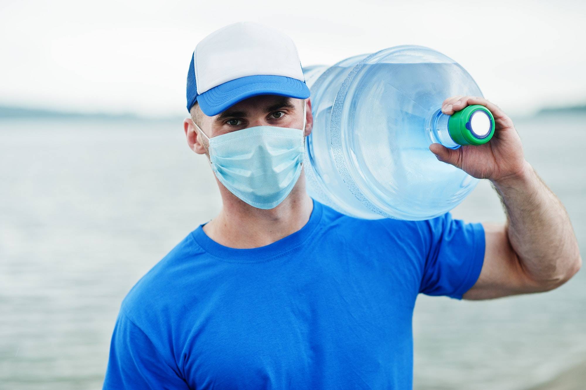 delivery-water-man-wear-protective-face-medical-mask-during-coronavirus-pandemia-.jpg